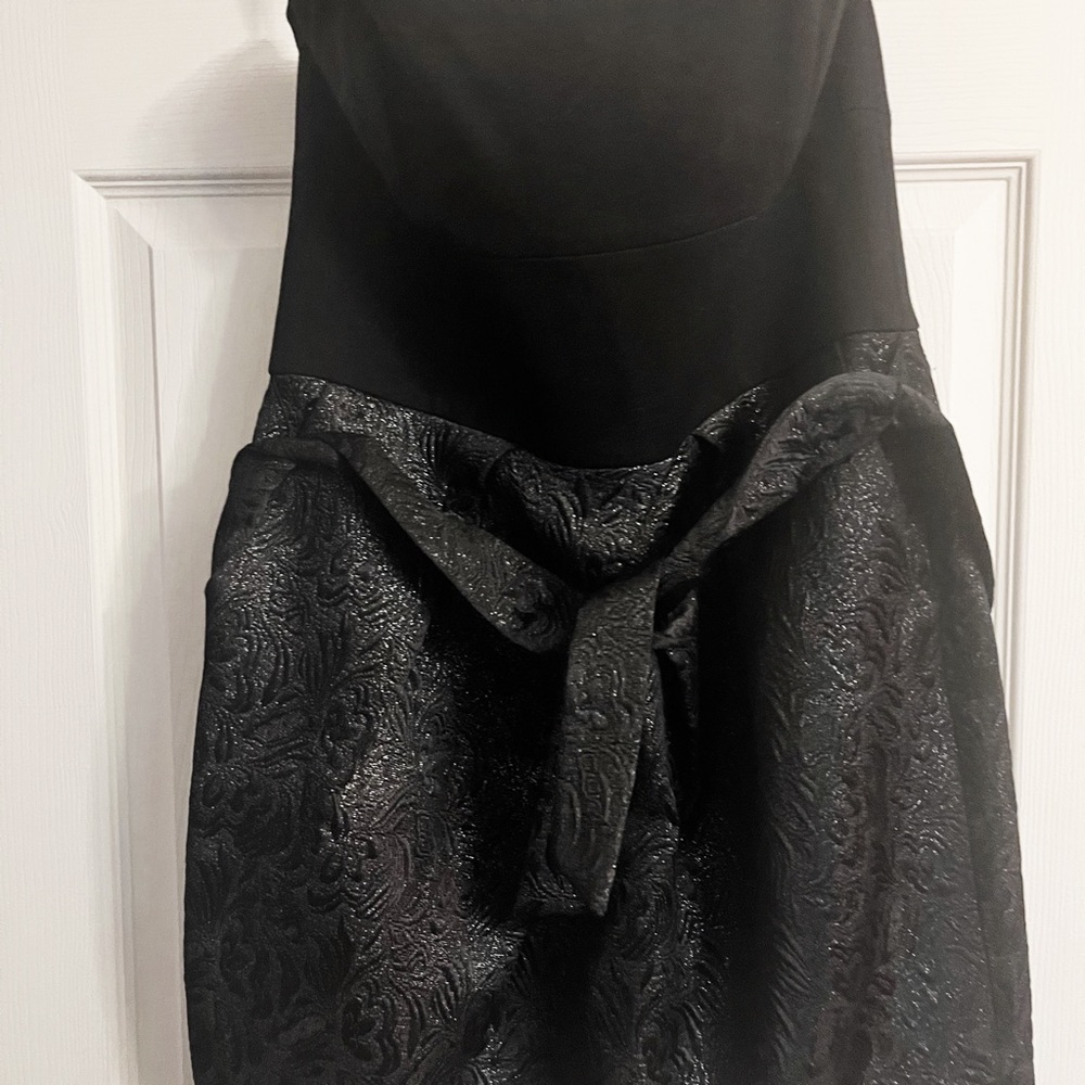 Black strapless minidress w/silver shimmer  w/adjustable bra support.